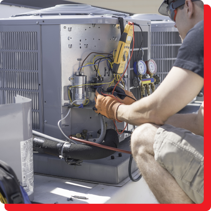 a man repairing an hvac unit